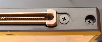 there is need to unscrew right side screw to remove rear Ultrabay 2000 cover, you must nothing to do with screws of data connector